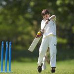 boy playing cricket