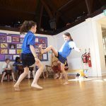 children in a sports lesson