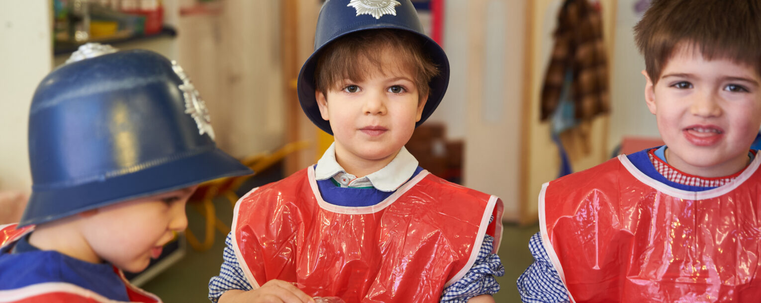 children wearing police hats
